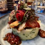 Poulpe grillé au chorizo Bellota et écrasé de pommes de terre aux herbes